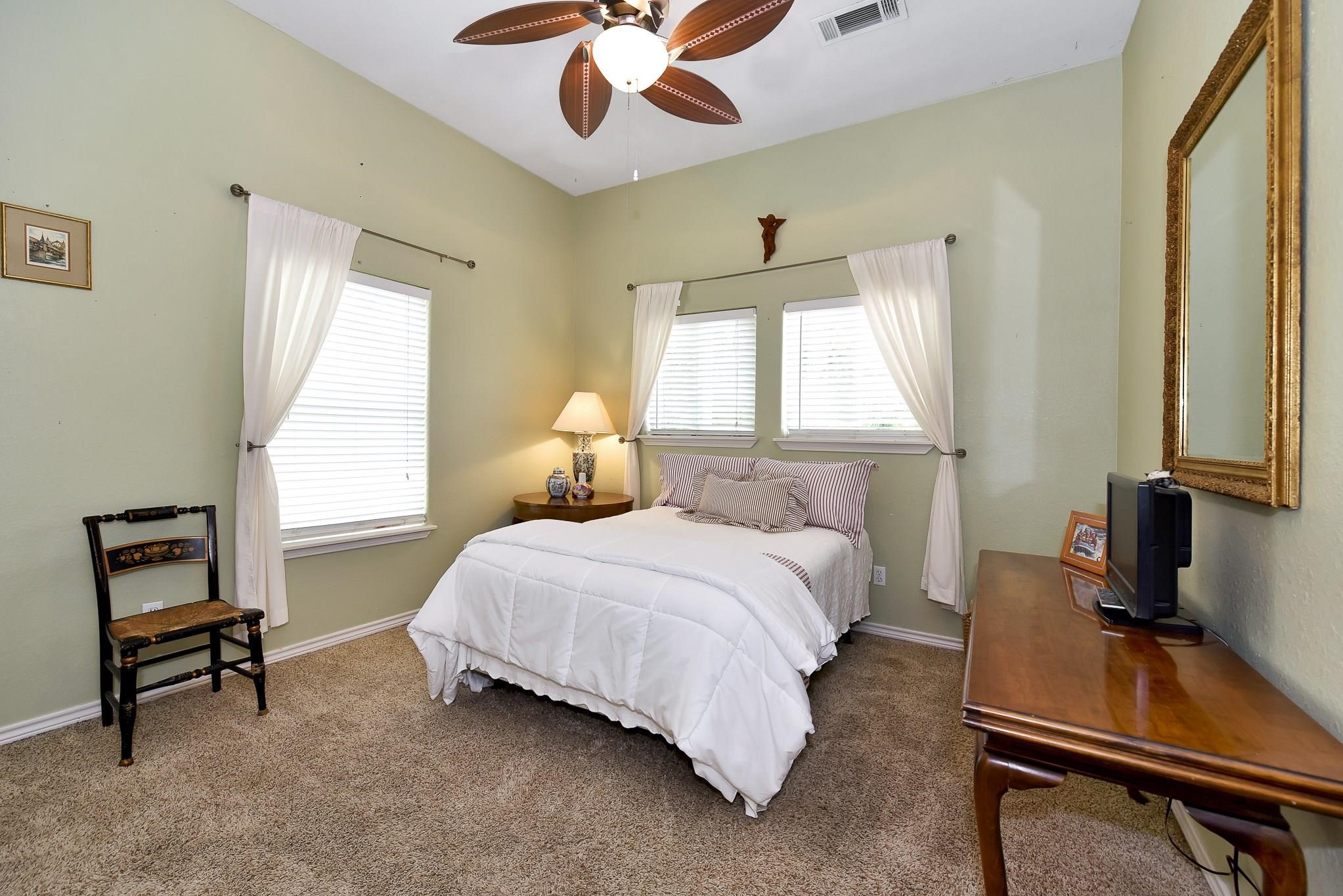 226 Valmar Kemah, TX 77565 - Photo 20 of 29 a bedroom with a bed and a window
