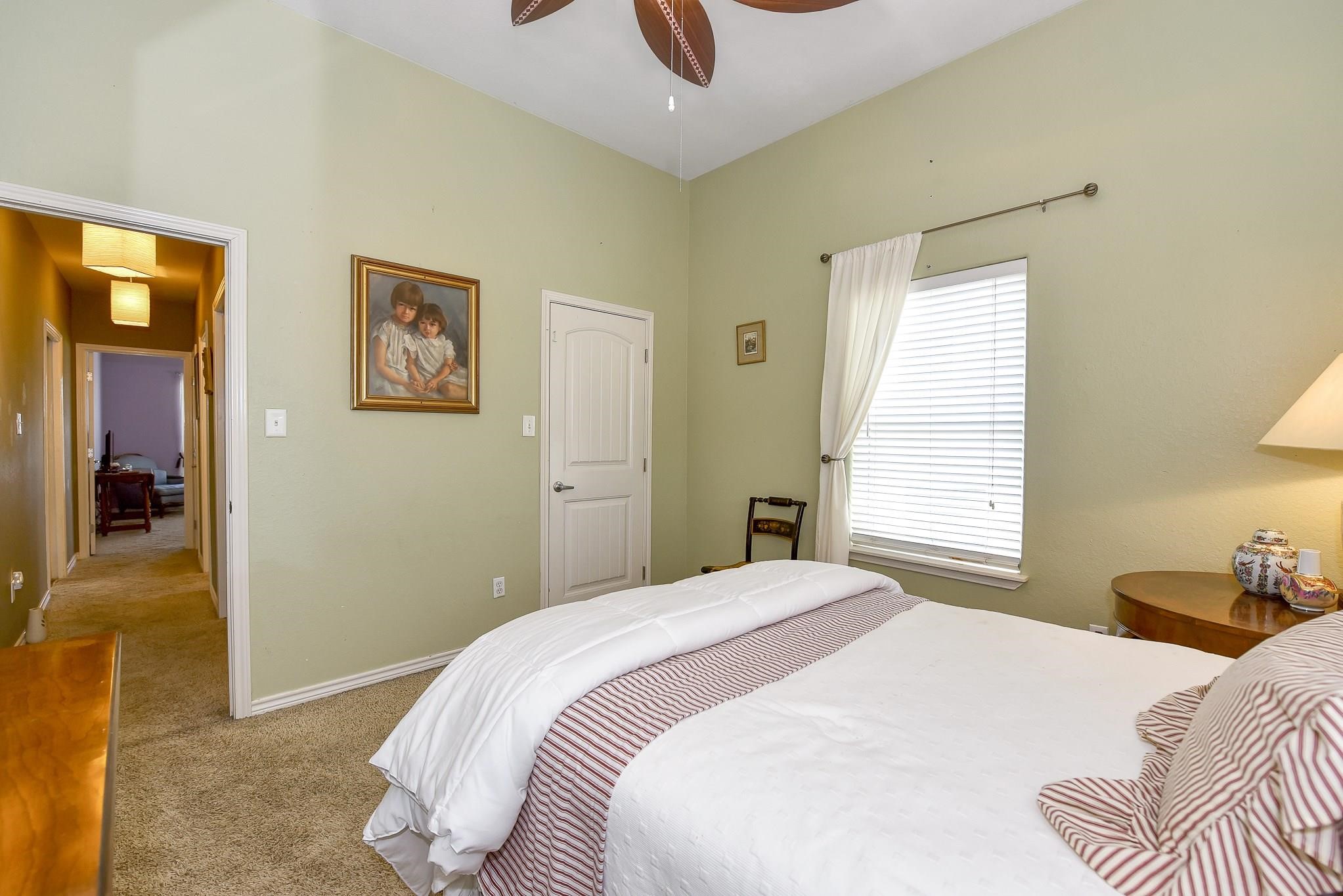 226 Valmar Kemah, TX 77565 - Photo 21 of 29 a bedroom with a bed and a painting on the wall