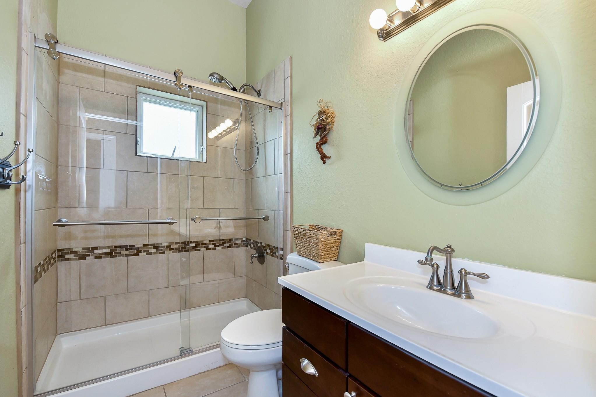 226 Valmar Kemah, TX 77565 - Photo 22 of 29 a bathroom with a sink a toilet and shower