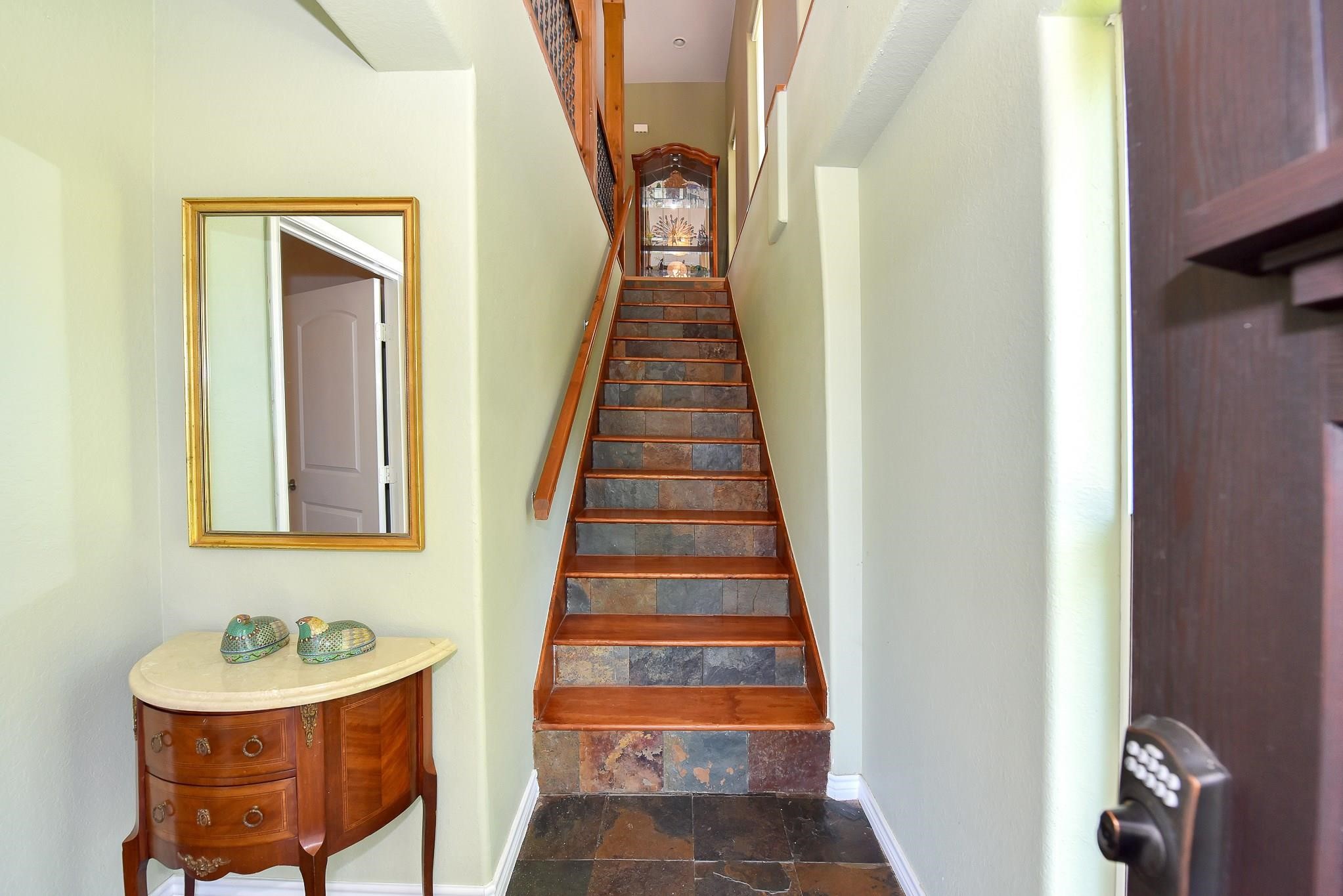 226 Valmar Kemah, TX 77565 - Photo 5 of 29 a view of a hallway with wooden floor and entryway