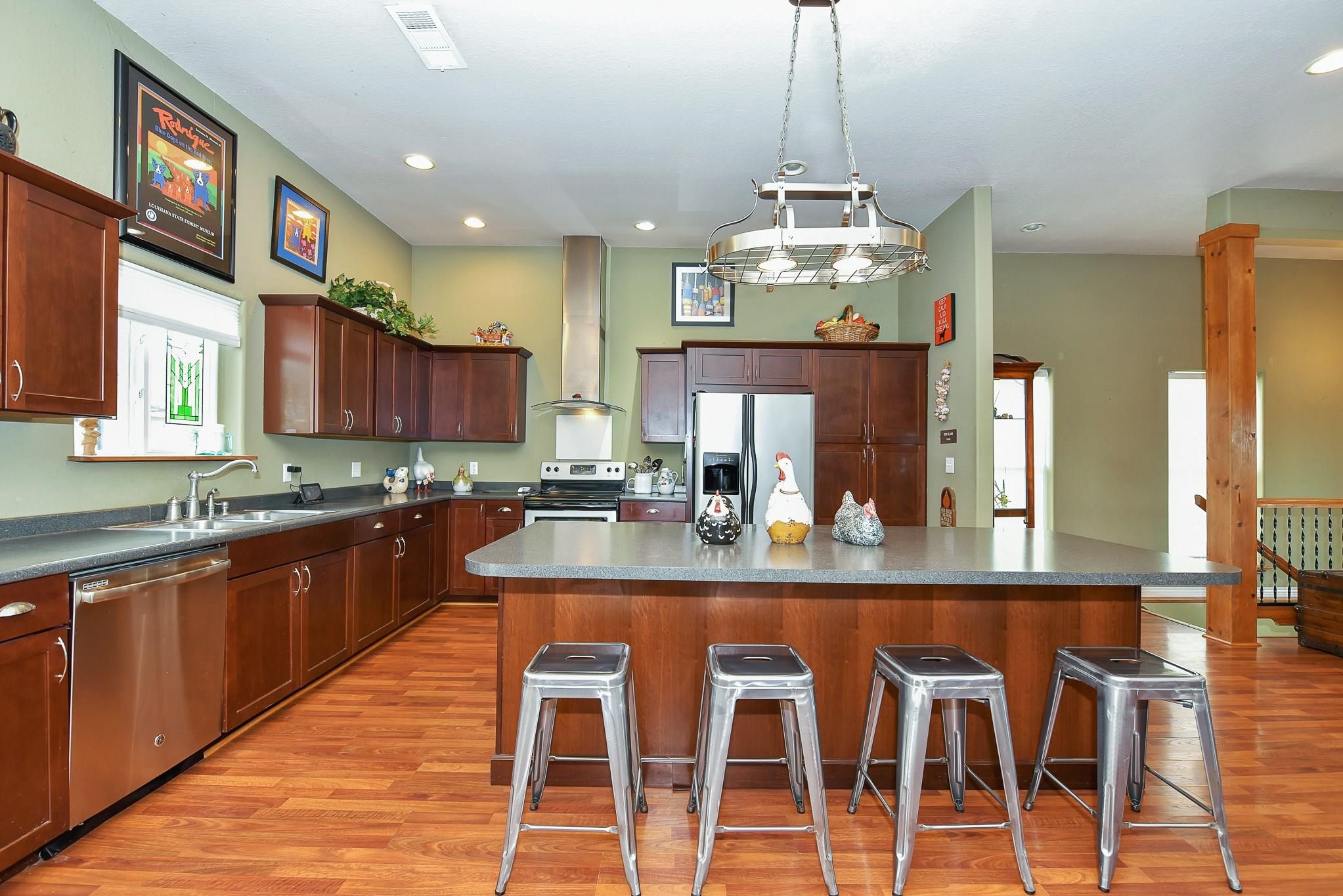 226 Valmar Kemah, TX 77565 - Photo 10 of 29 a large kitchen with a table and chairs in it