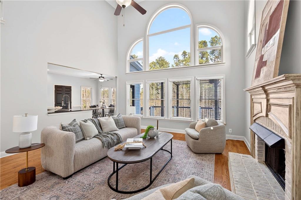 167 Calming Water Trail Dallas, GA 30132 - Photo 14 of 64 a living room with furniture a fireplace and a large window