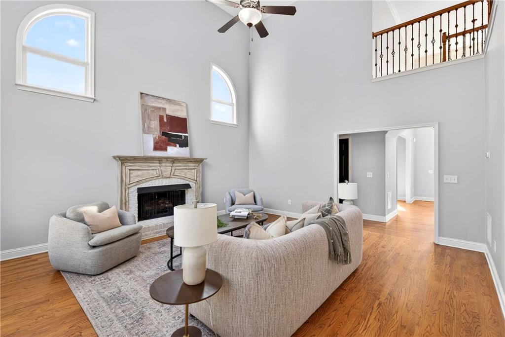167 Calming Water Trail Dallas, GA 30132 - Photo 15 of 64 a living room with furniture a fireplace and a table