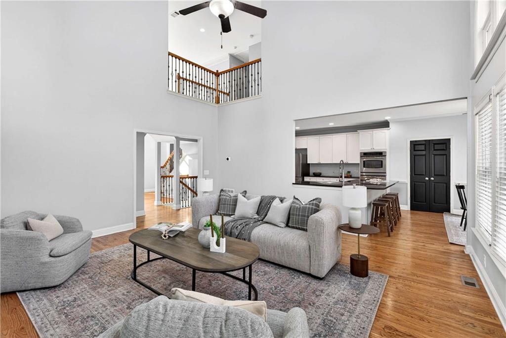 167 Calming Water Trail Dallas, GA 30132 - Photo 16 of 64 a living room with furniture and a wooden floor