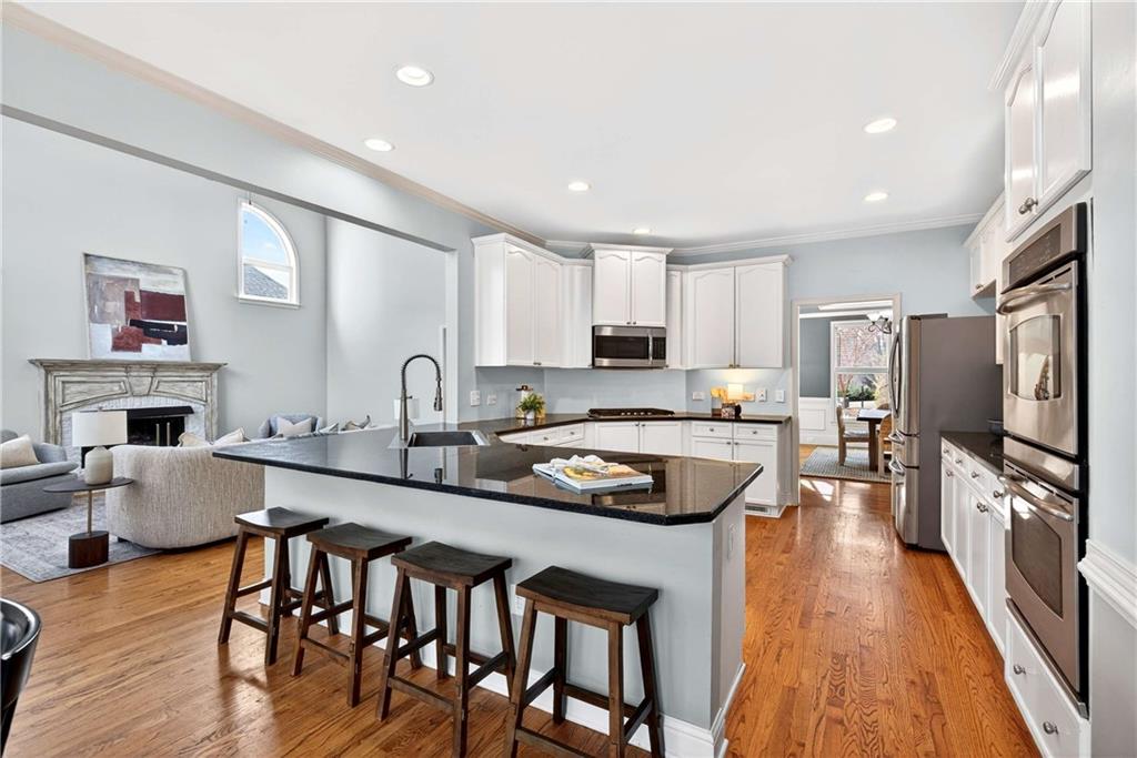 167 Calming Water Trail Dallas, GA 30132 - Photo 18 of 64 a kitchen with stainless steel appliances granite countertop a stove refrigerator sink and cabinets