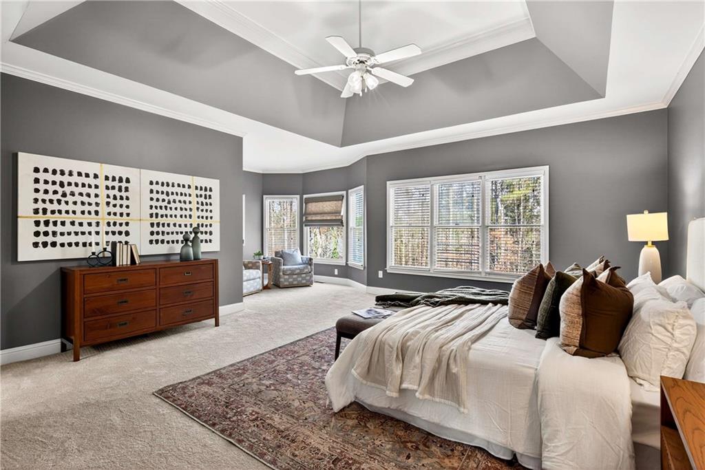 167 Calming Water Trail Dallas, GA 30132 - Photo 22 of 64 a bedroom with a large bed and a dresser