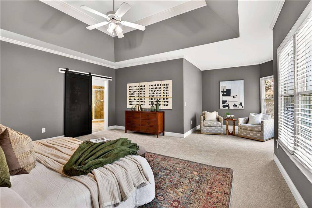 167 Calming Water Trail Dallas, GA 30132 - Photo 24 of 64 a bedroom with a large bed and furniture