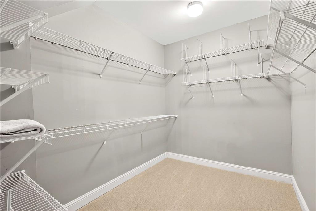 167 Calming Water Trail Dallas, GA 30132 - Photo 27 of 64 a view of a room with racks on the wall