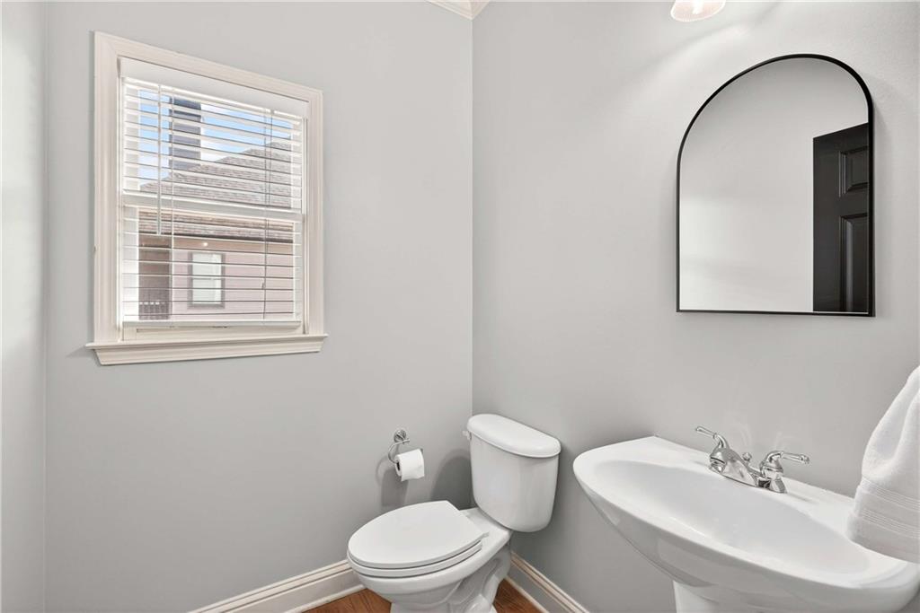 167 Calming Water Trail Dallas, GA 30132 - Photo 28 of 64 a white toilet sitting next to a bathroom sink