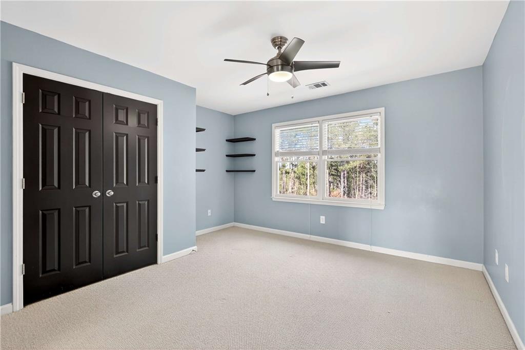 167 Calming Water Trail Dallas, GA 30132 - Photo 29 of 64 a view of an empty room with a window