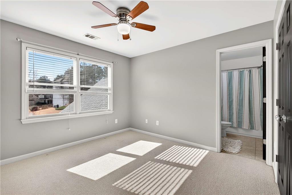 167 Calming Water Trail Dallas, GA 30132 - Photo 32 of 64 a view of an empty room with a window