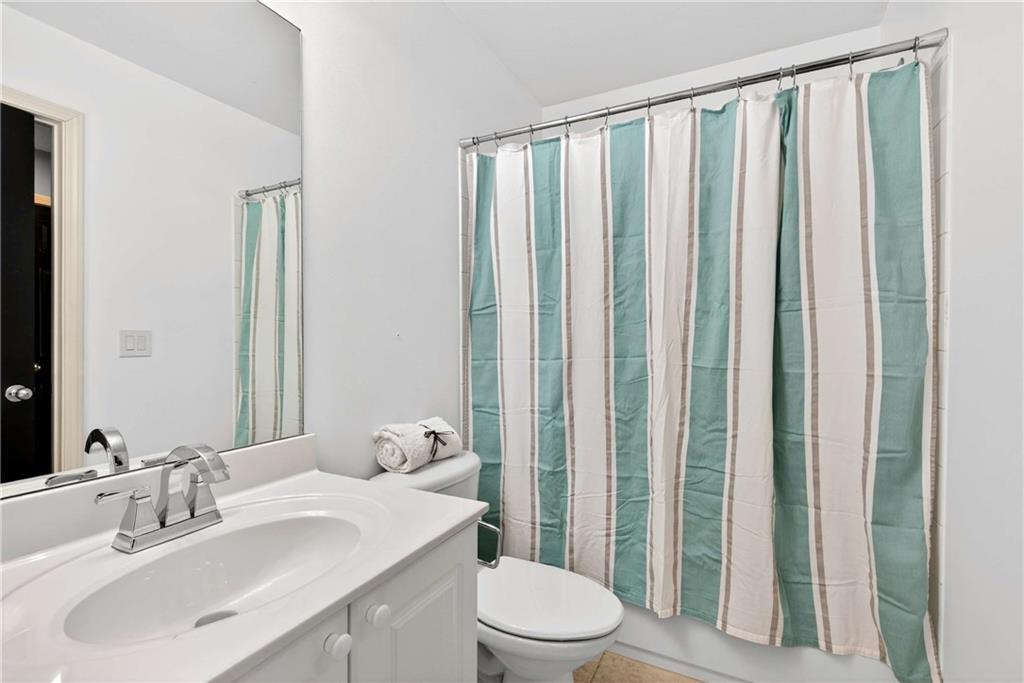 167 Calming Water Trail Dallas, GA 30132 - Photo 34 of 64 a bathroom with a sink a toilet and shower