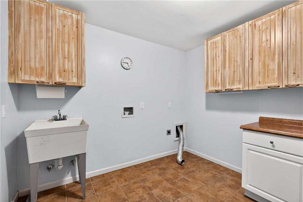 167 Calming Water Trail Dallas, GA 30132 - Photo 38 of 64 a room with a window and a kitchen area