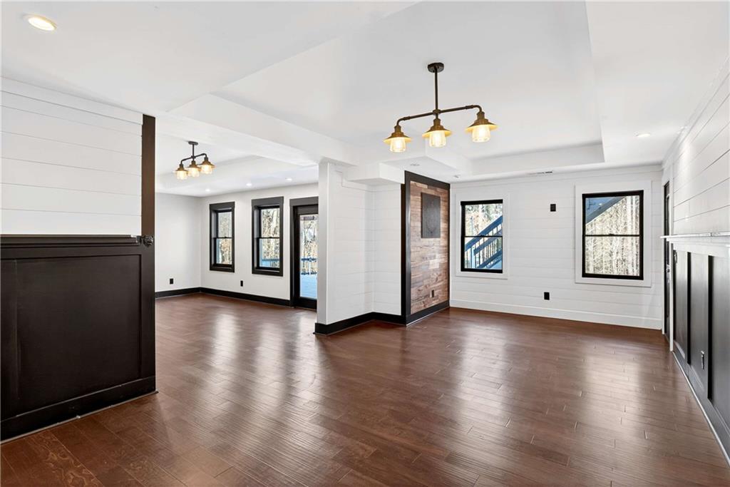 167 Calming Water Trail Dallas, GA 30132 - Photo 43 of 64 a view of an empty room with window and wooden floor