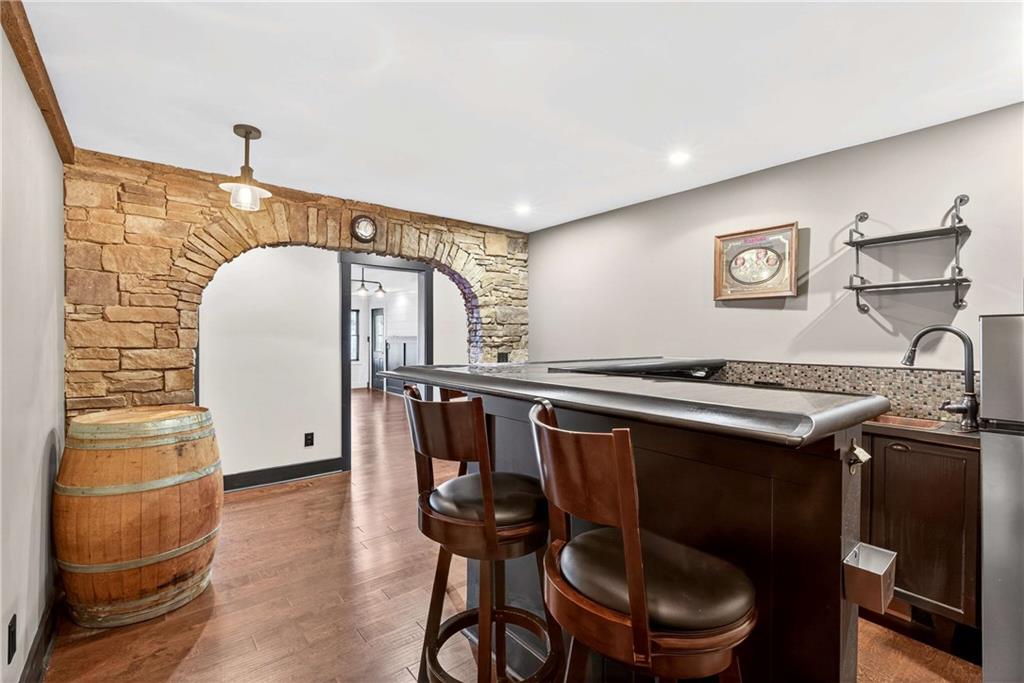 167 Calming Water Trail Dallas, GA 30132 - Photo 47 of 64 a bathroom with a sink a toilet and a mirror