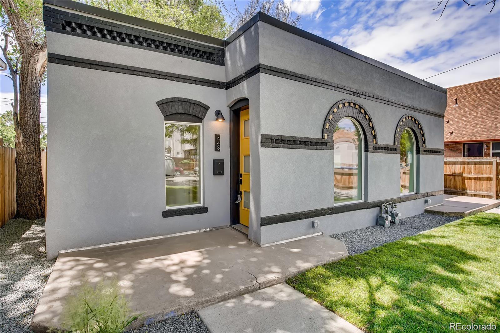 443 Inca Street Denver, CO 80204 - Photo 2 of 13 a front view of a house with garden