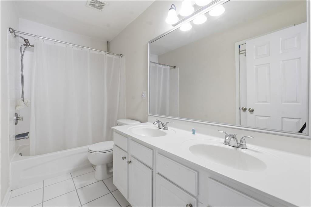 38 Crystal Downs Way Northeast Suwanee, GA 30024 - Photo 32 of 44 a bathroom with a double vanity sink mirror and toilet