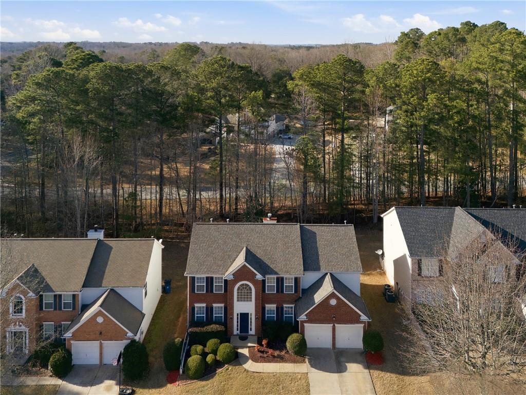 38 Crystal Downs Way Northeast Suwanee, GA 30024 - Photo 41 of 44 an aerial view of a house with a garden