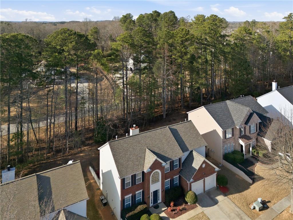 38 Crystal Downs Way Northeast Suwanee, GA 30024 - Photo 42 of 44 an aerial view of a house with a yard from balcony