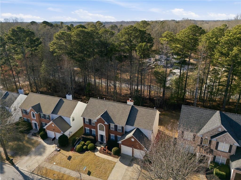 38 Crystal Downs Way Northeast Suwanee, GA 30024 - Photo 43 of 44 an aerial view of a house with pool outdoor seating and mountain view