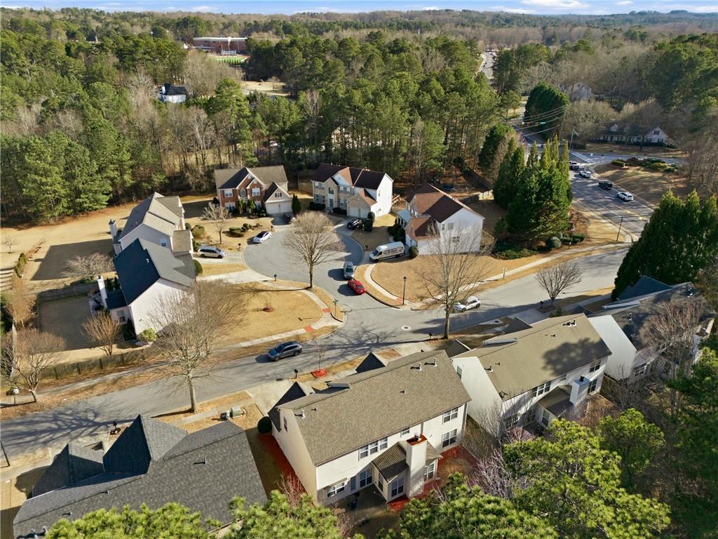 38 Crystal Downs Way Northeast Suwanee, GA 30024 - Photo 44 of 44 an aerial view of a house with a swimming pool
