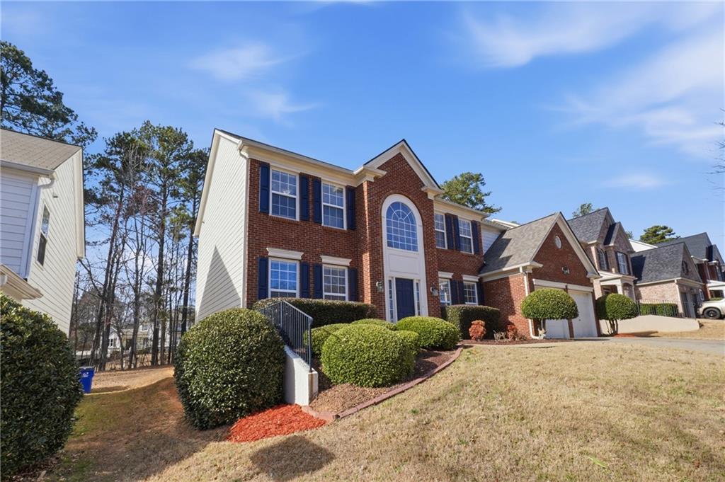 38 Crystal Downs Way Northeast Suwanee, GA 30024 - Photo 6 of 44 a view of multiple houses with a street
