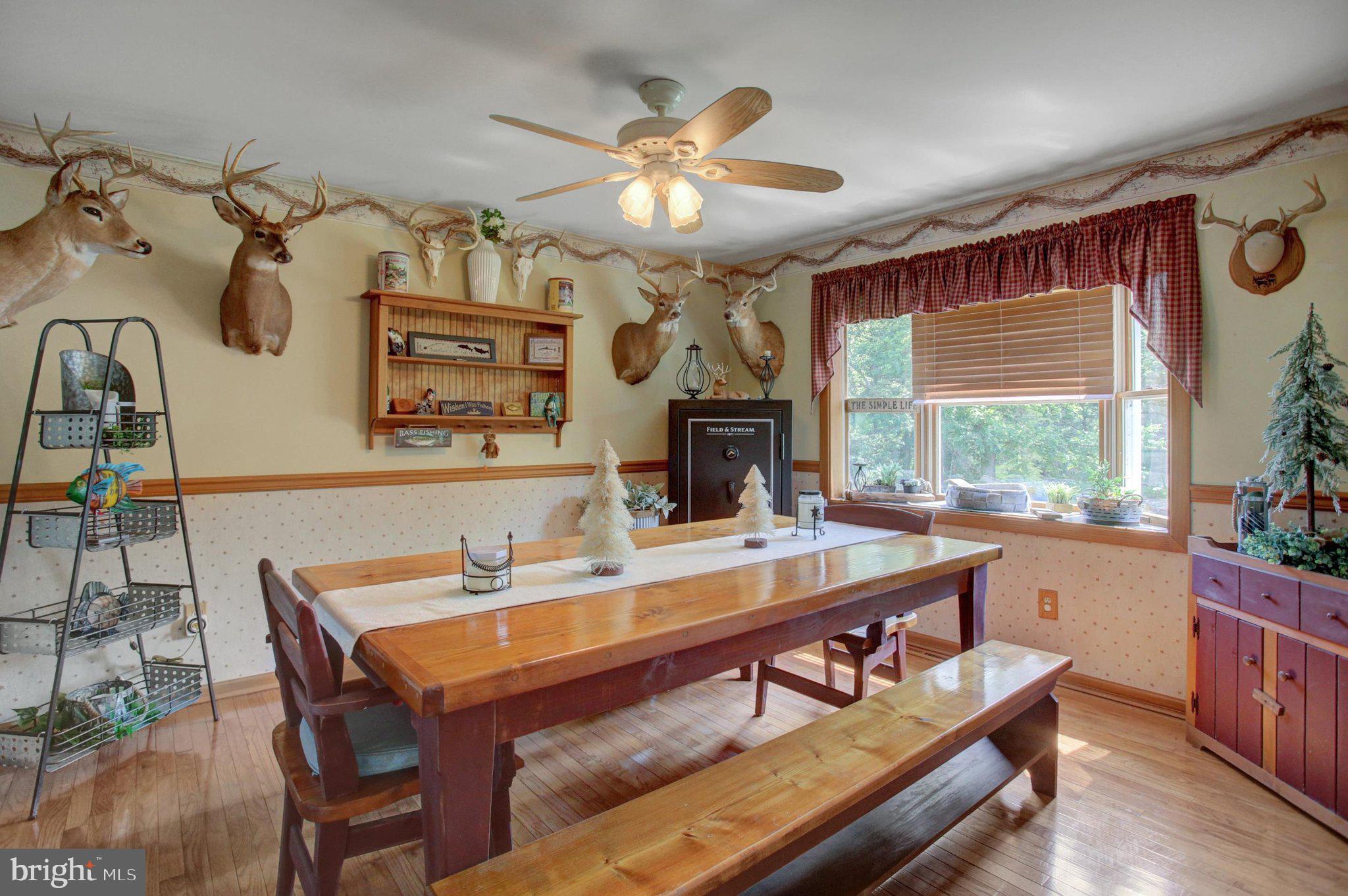 11086 Welsh Run Road Greencastle, PA 17225 - Photo 15 of 63 a dining room with a large window table and chairs