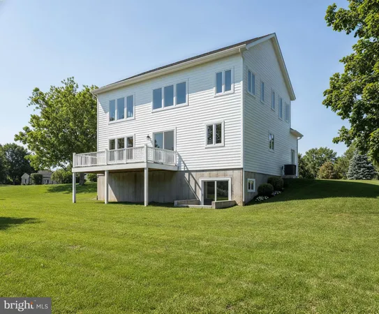 a front view of house with yard and trees