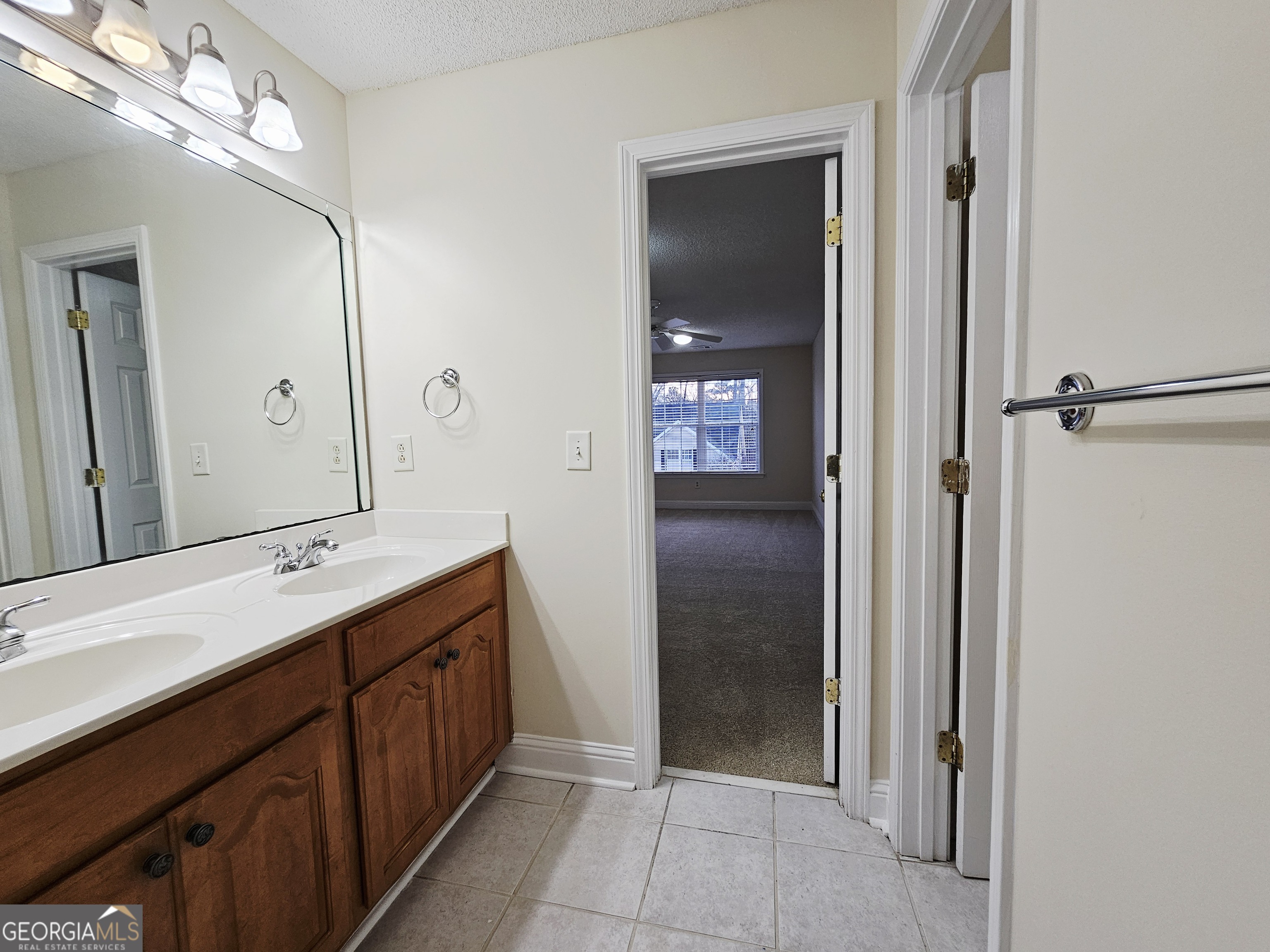122 High Ridge Drive Macon, GA 31220 - Photo 22 of 25 a bathroom with a double vanity sink and mirror