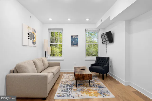 a living room with furniture and a window