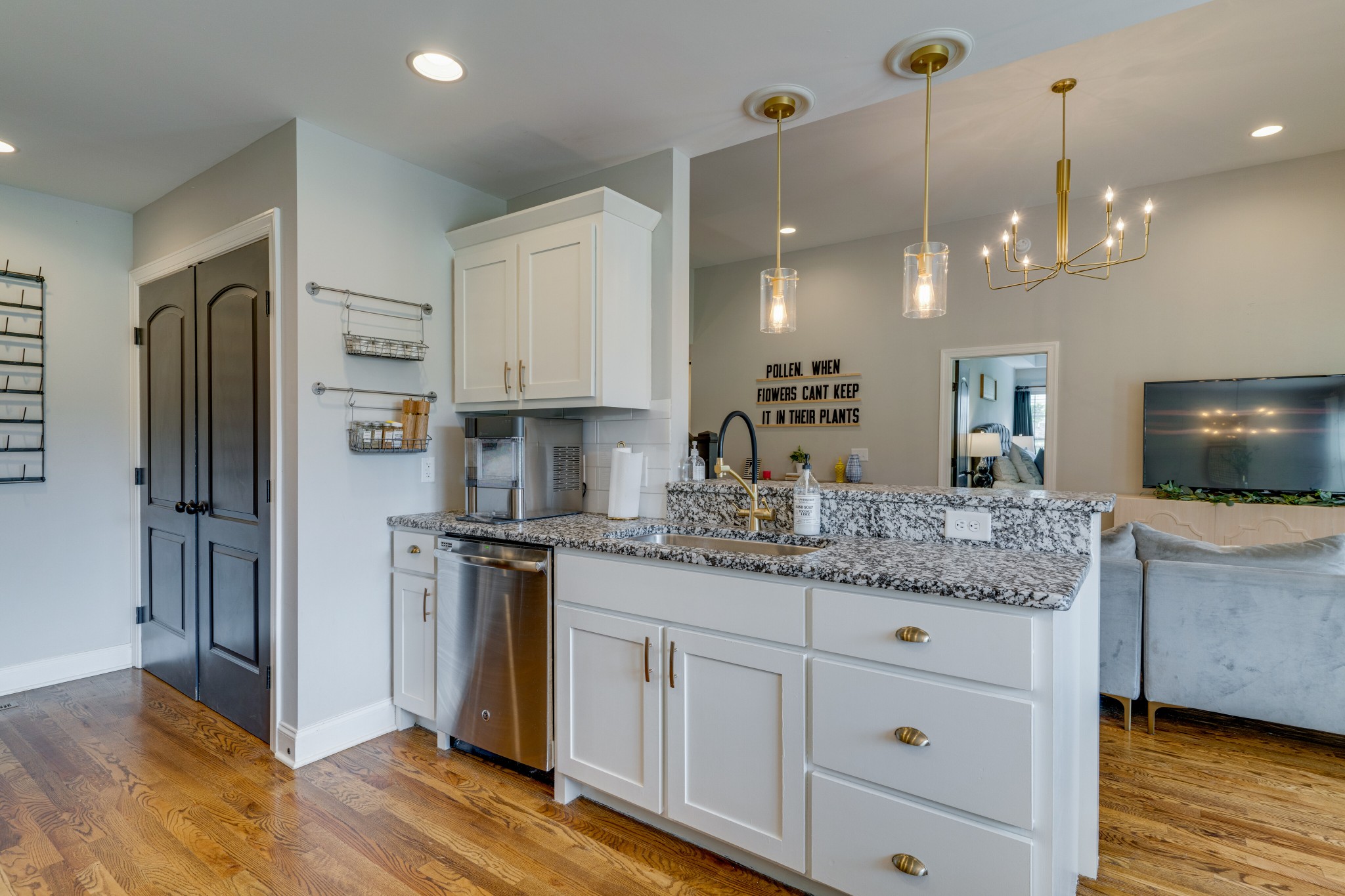 338 Tom Ferrell Road Portland, TN 37148 - Photo 11 of 26 a kitchen with kitchen island granite countertop a stove a refrigerator and a sink