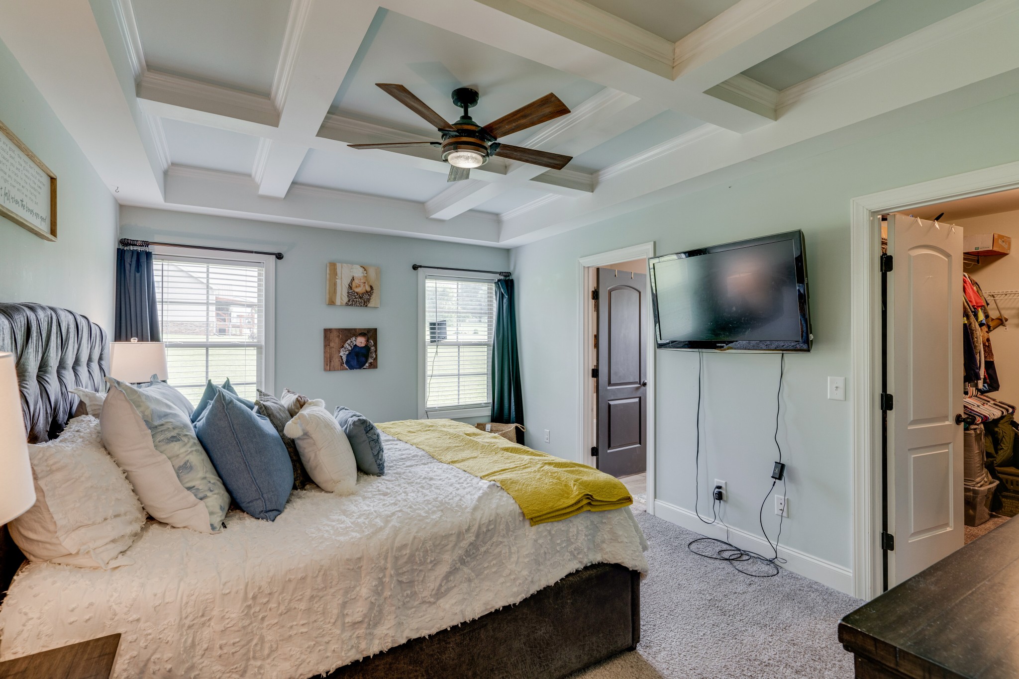 338 Tom Ferrell Road Portland, TN 37148 - Photo 14 of 26 a bedroom with a bed and a flat screen tv