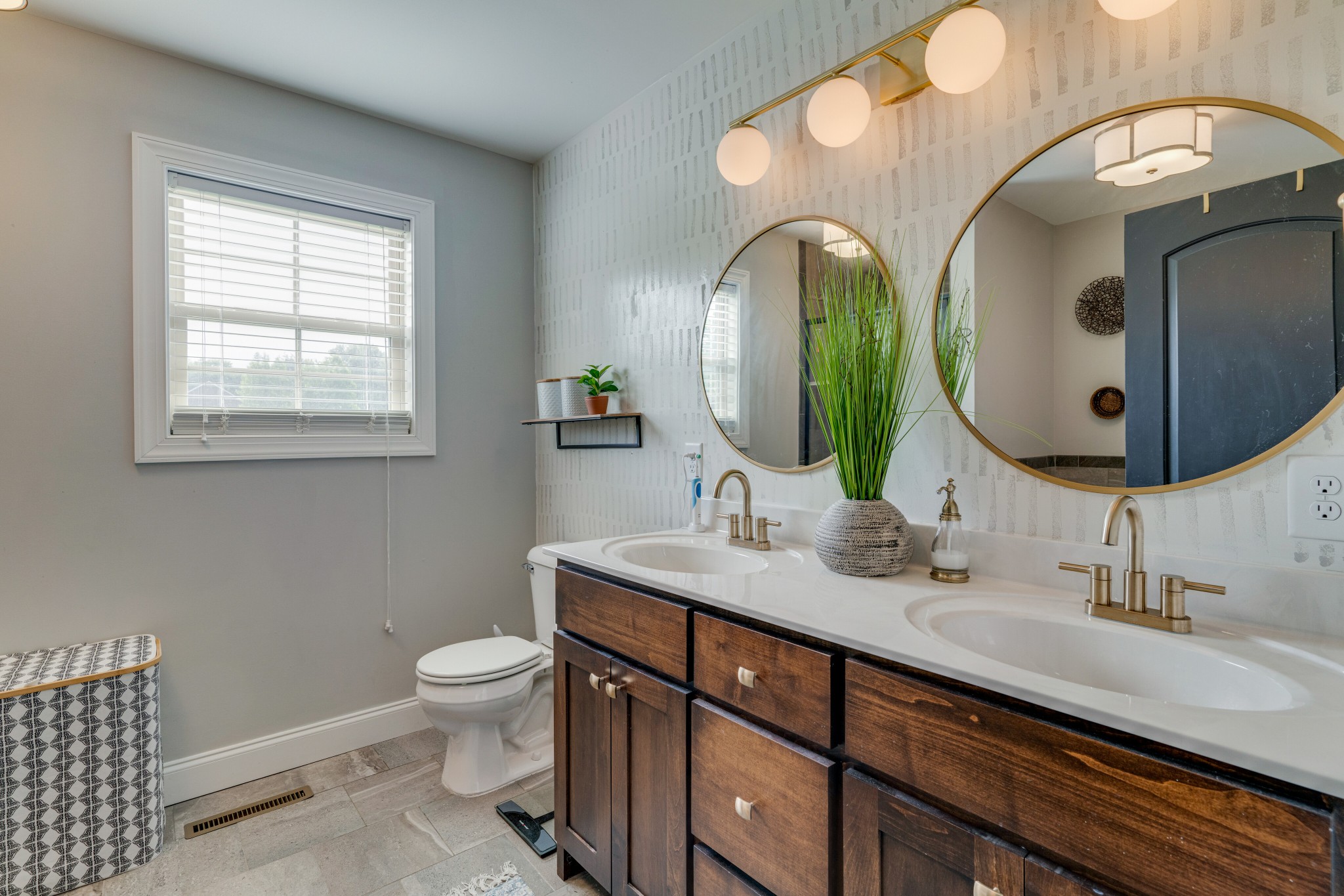 338 Tom Ferrell Road Portland, TN 37148 - Photo 15 of 26 a bathroom with a double vanity sink and a mirror