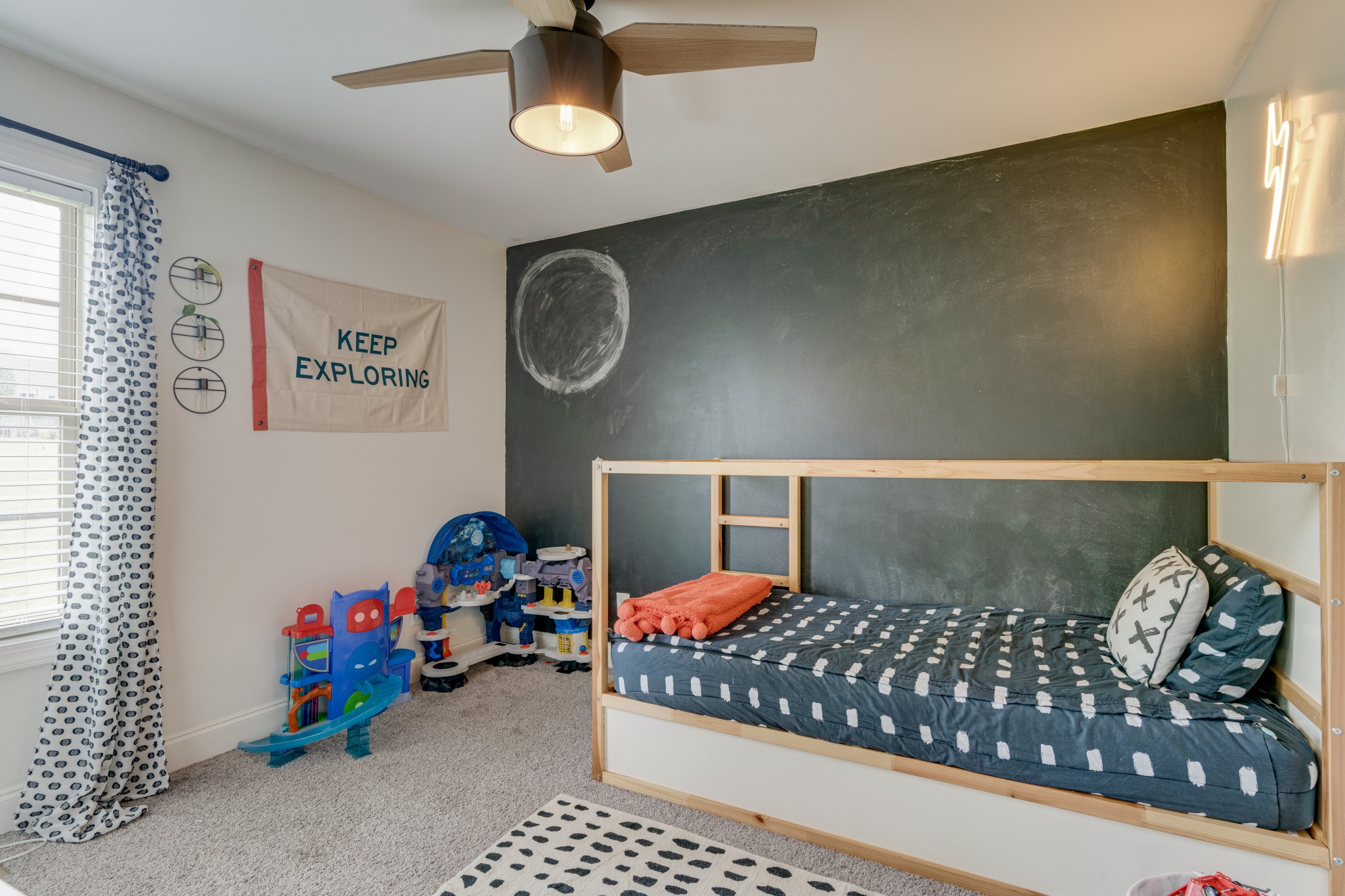 338 Tom Ferrell Road Portland, TN 37148 - Photo 19 of 26 a bedroom with a bed and a chandelier