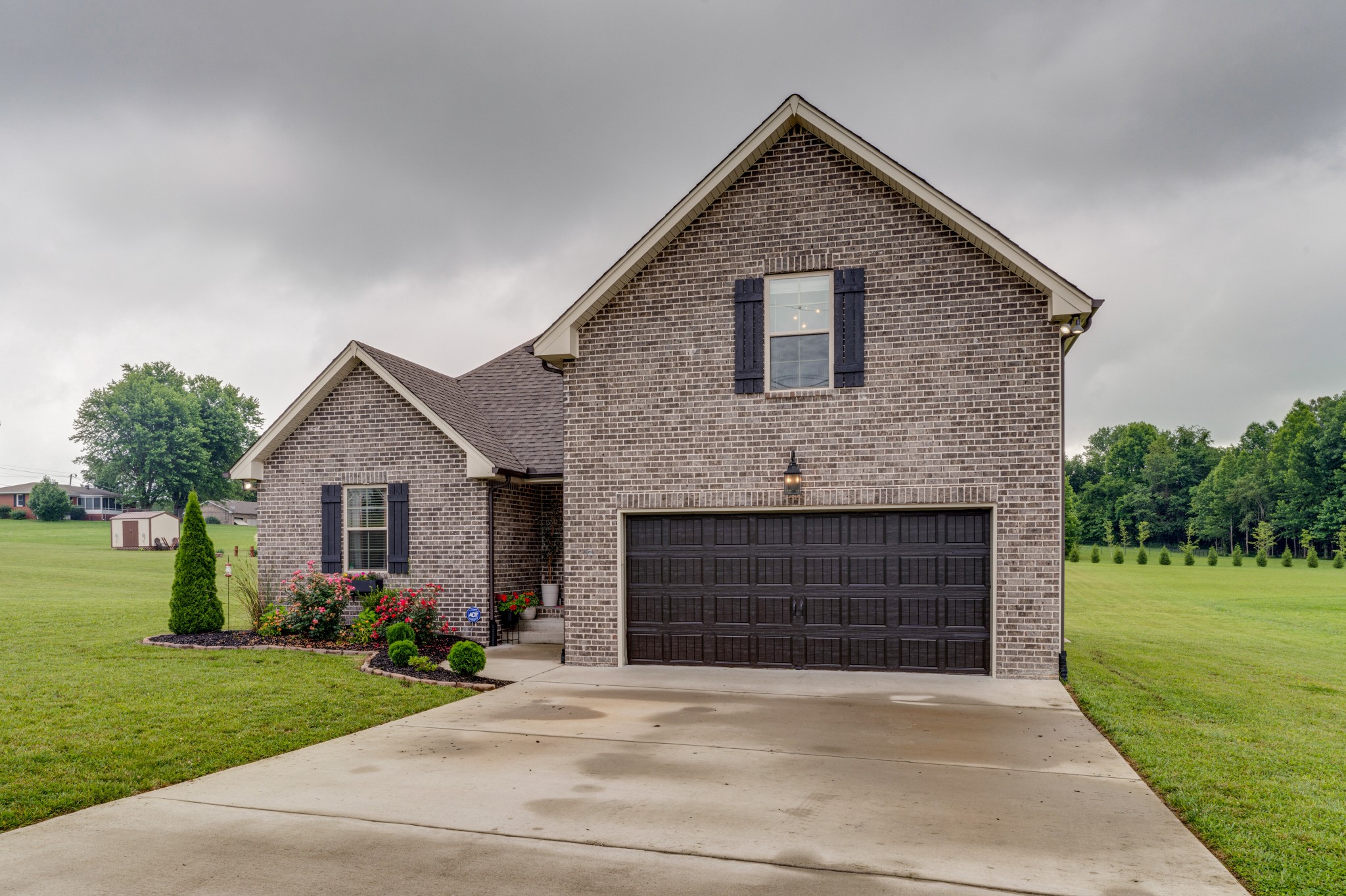 338 Tom Ferrell Road Portland, TN 37148 - Photo 3 of 26 a front view of a house with a garden and yard