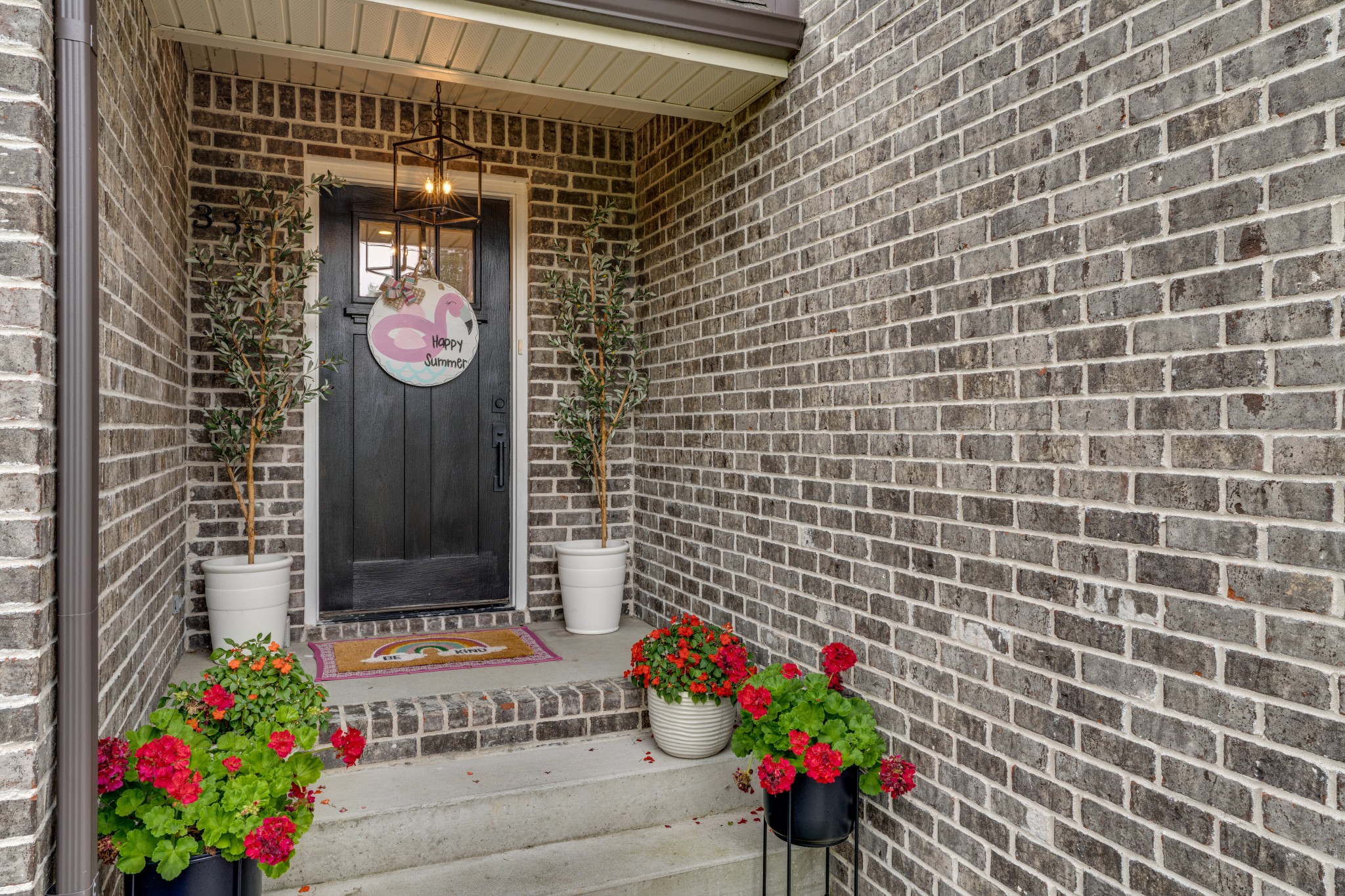 338 Tom Ferrell Road Portland, TN 37148 - Photo 4 of 26 a front view of a house with flowers