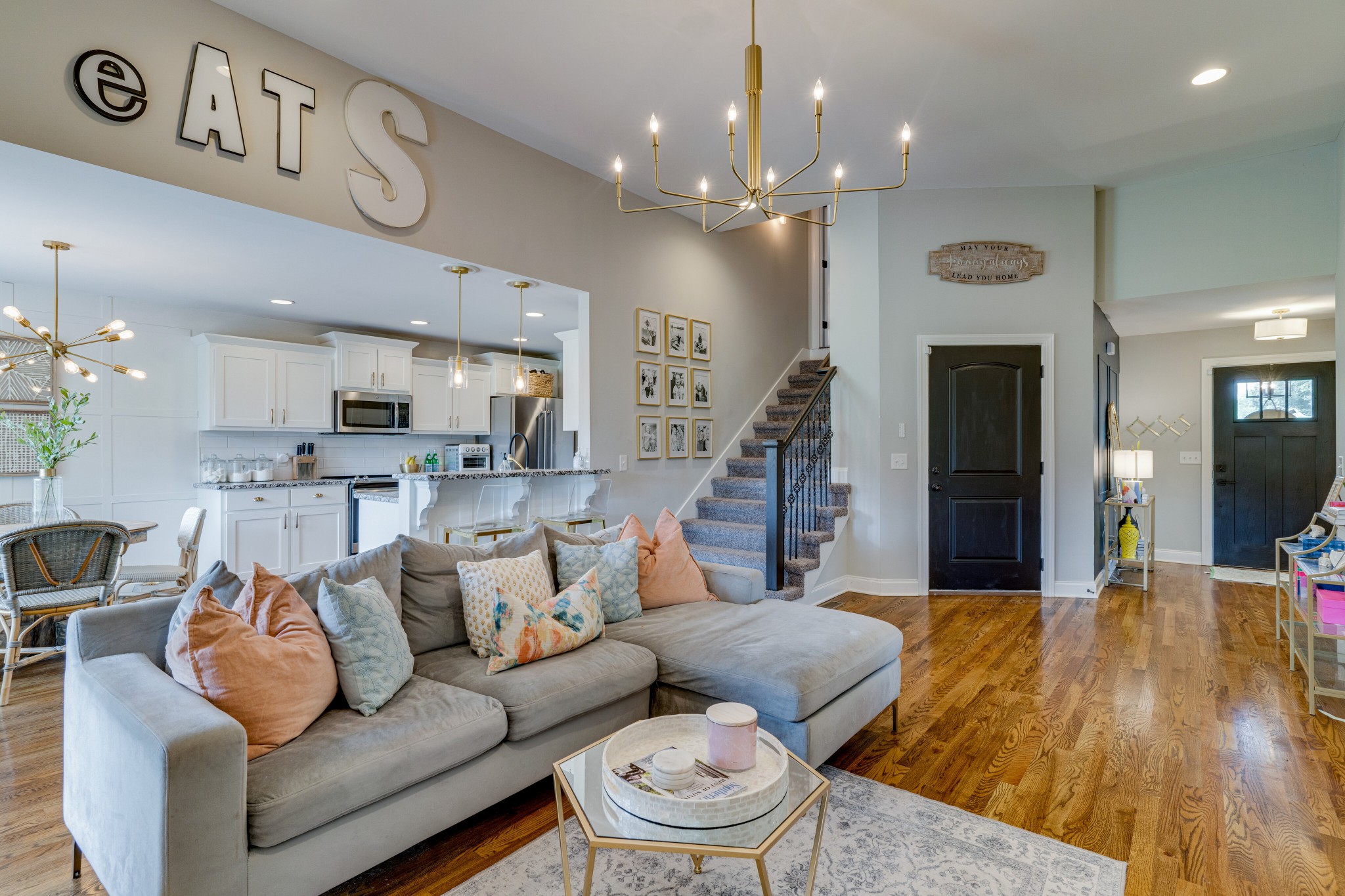 338 Tom Ferrell Road Portland, TN 37148 - Photo 7 of 26 a living room with furniture and a chandelier