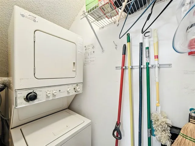 a bedroom with a large bed and a dresser
