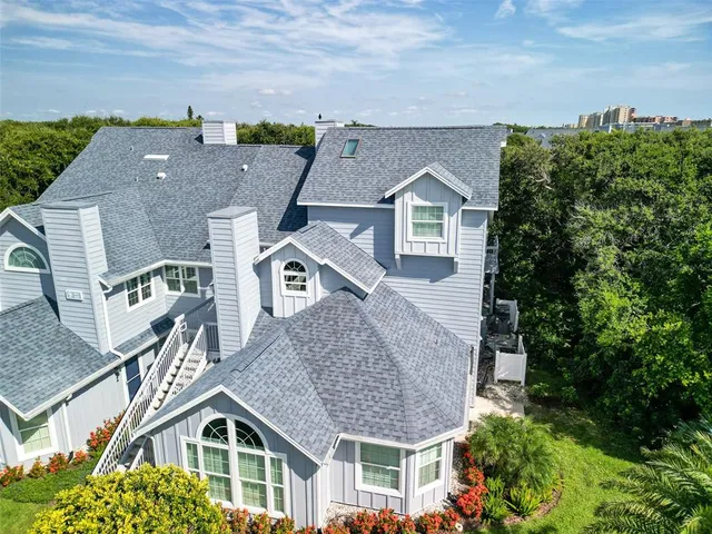 aerial view of a house with a yard