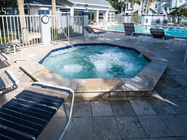 a view of a swimming pool with a patio