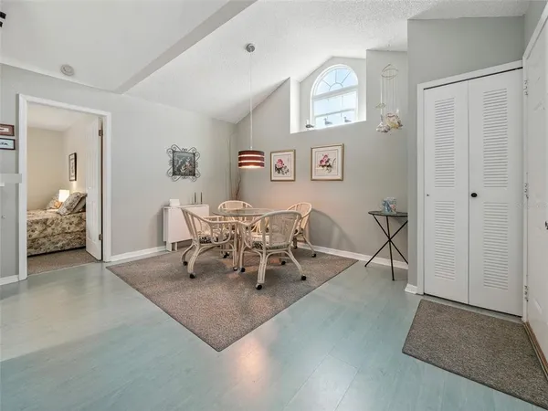 a view of a livingroom with furniture and a dining table