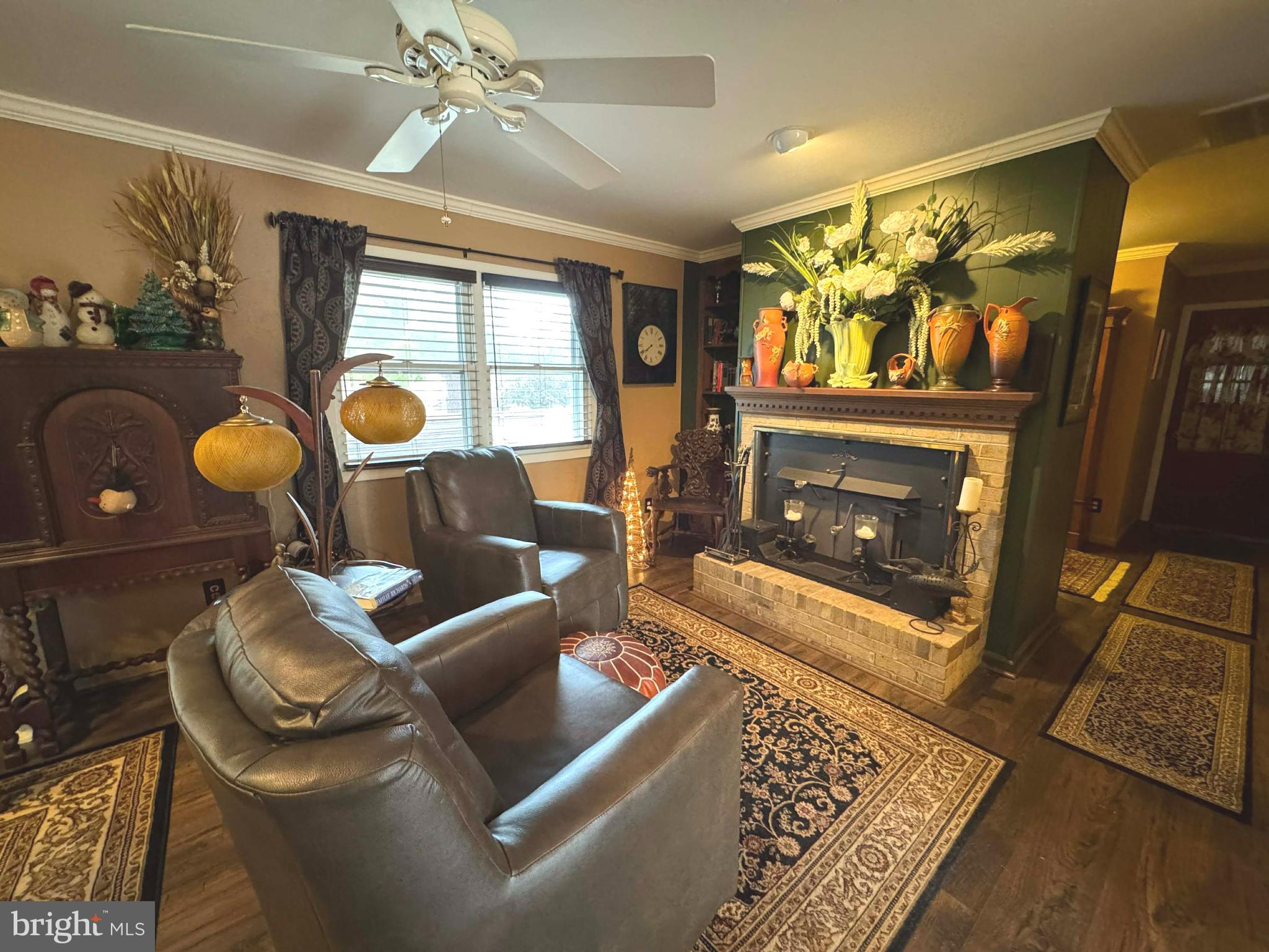 5000 Joshua Thomas Road Marion Station, MD 21838 - Photo 34 of 81 a living room with furniture and a fireplace