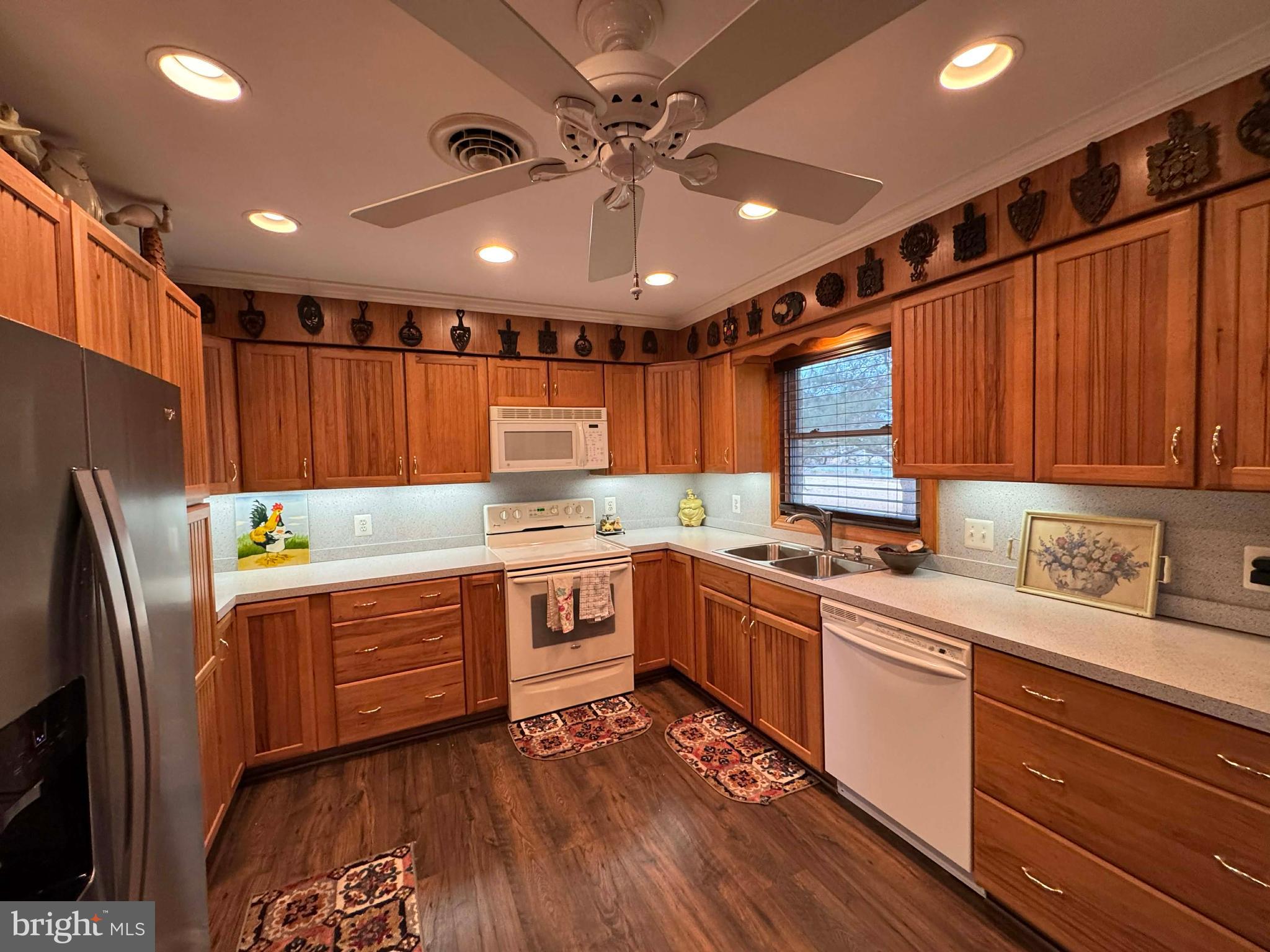 5000 Joshua Thomas Road Marion Station, MD 21838 - Photo 34 of 77 a kitchen with stainless steel appliances granite countertop a sink a stove and a refrigerator