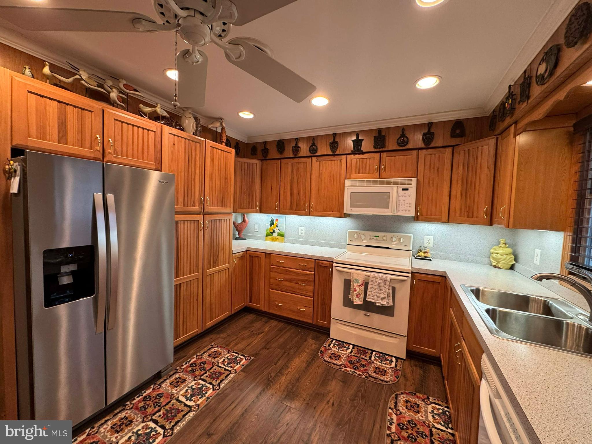 5000 Joshua Thomas Road Marion Station, MD 21838 - Photo 36 of 77 a kitchen with stainless steel appliances a refrigerator sink and cabinets