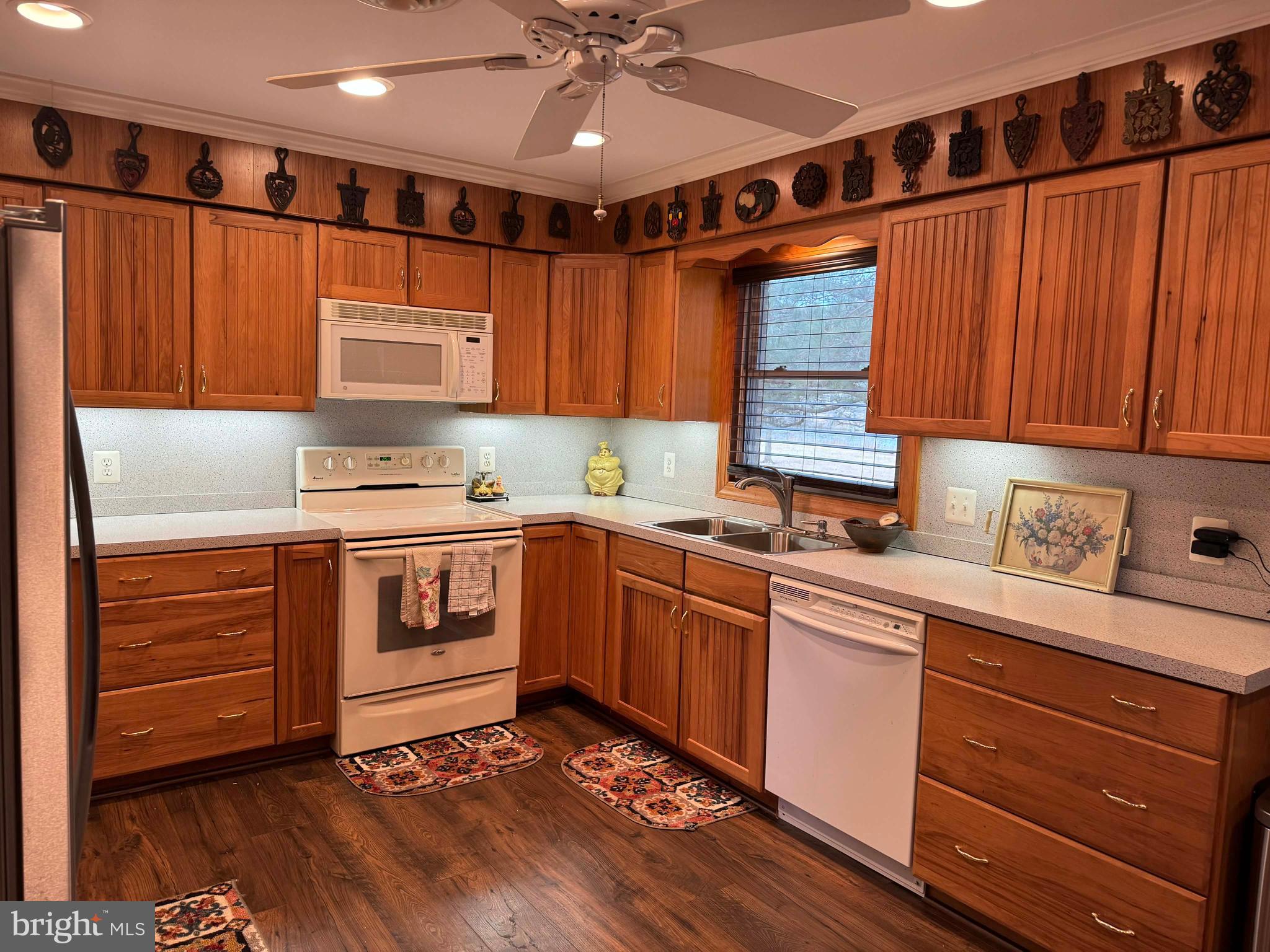 5000 Joshua Thomas Road Marion Station, MD 21838 - Photo 37 of 77 a kitchen with a sink window and cabinets