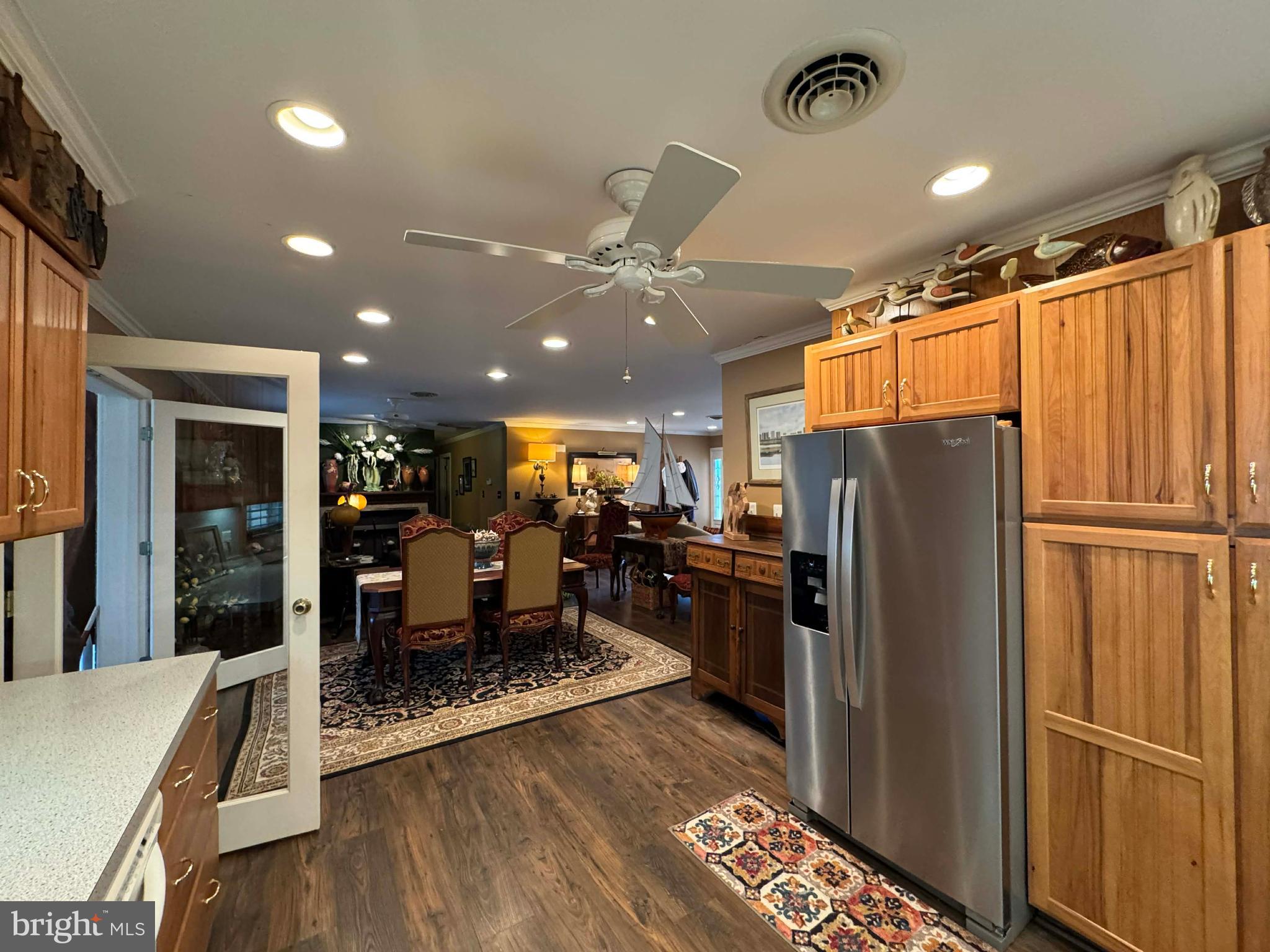 5000 Joshua Thomas Road Marion Station, MD 21838 - Photo 38 of 77 a dining room with stainless steel appliances furniture refrigerator and wooden floor