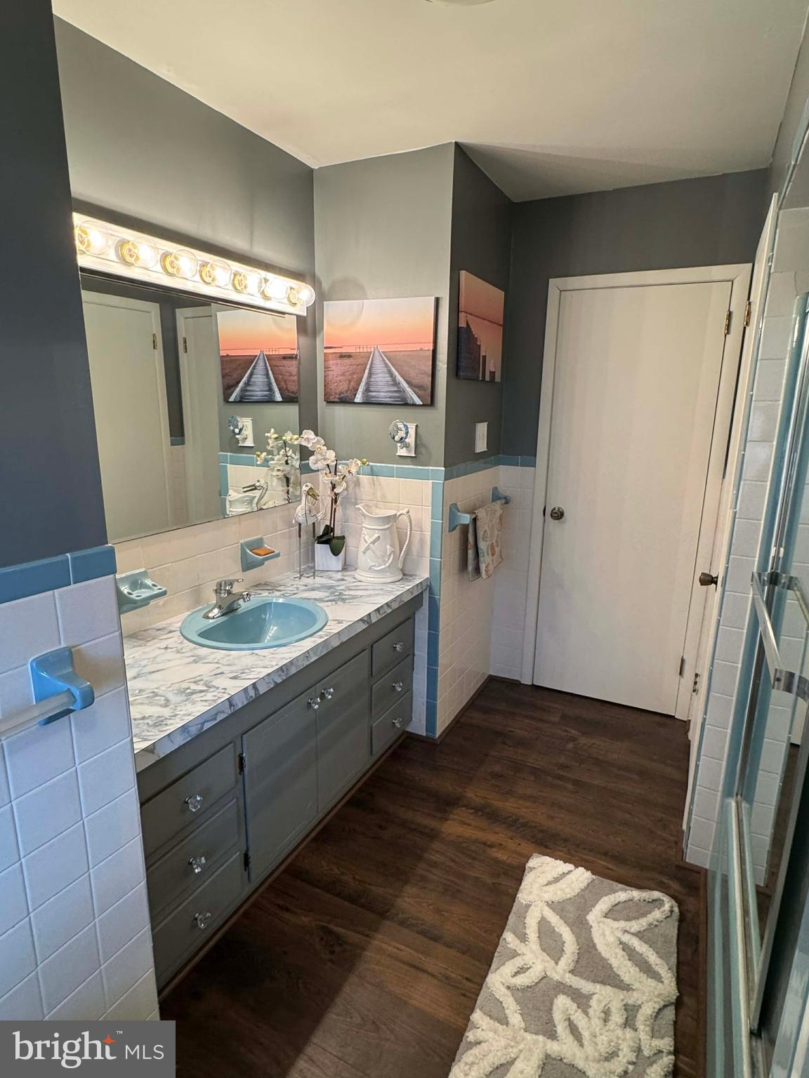5000 Joshua Thomas Road Marion Station, MD 21838 - Photo 57 of 81 a bathroom with a double vanity sink and mirror