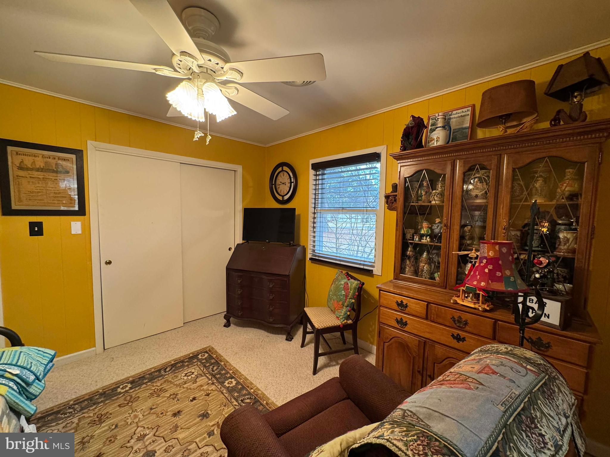 5000 Joshua Thomas Road Marion Station, MD 21838 - Photo 60 of 77 a living room with furniture a lamp and a chandelier