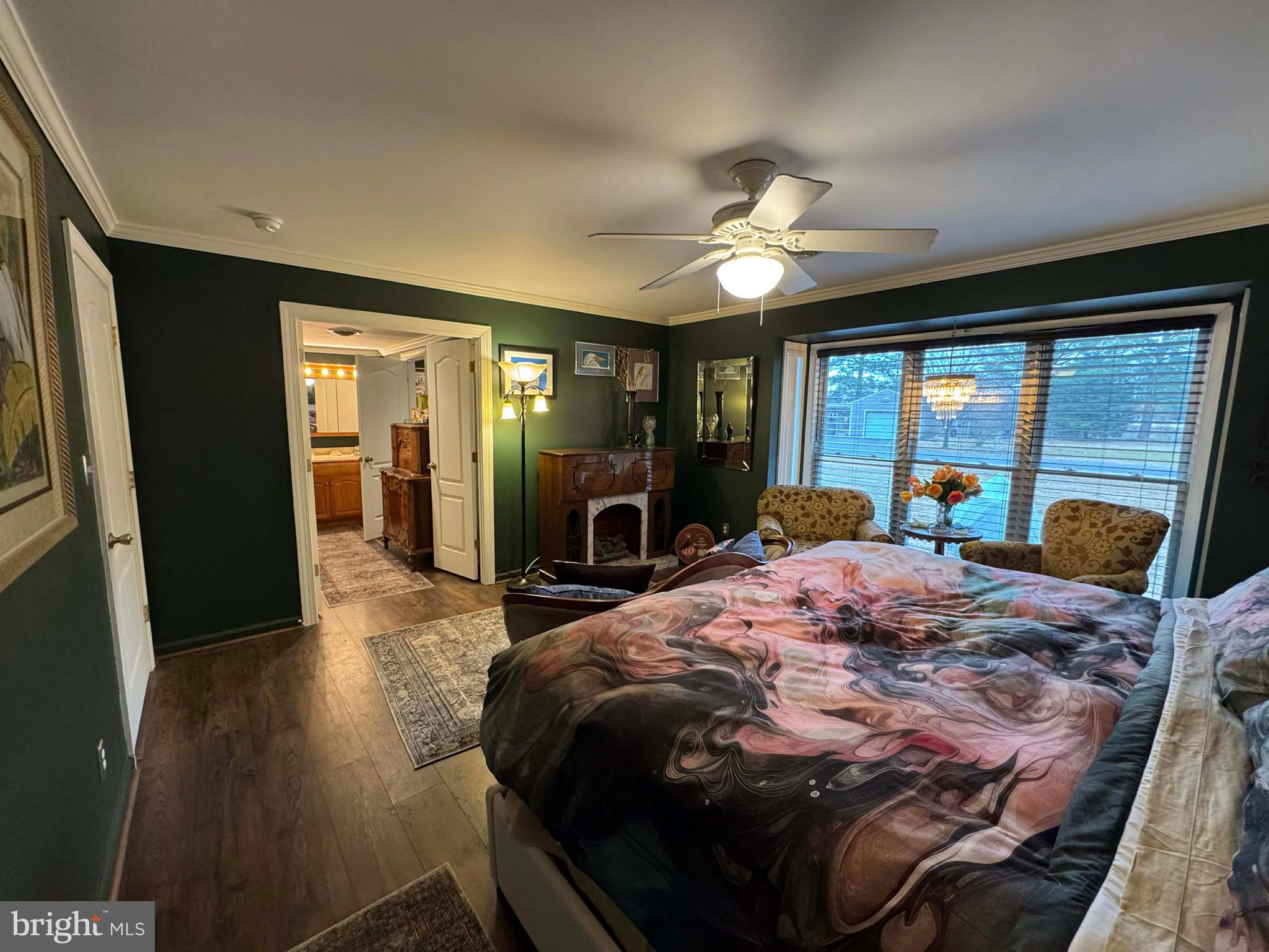 5000 Joshua Thomas Road Marion Station, MD 21838 - Photo 69 of 77 a bedroom with a bed and a large mirror with a flat tv screen