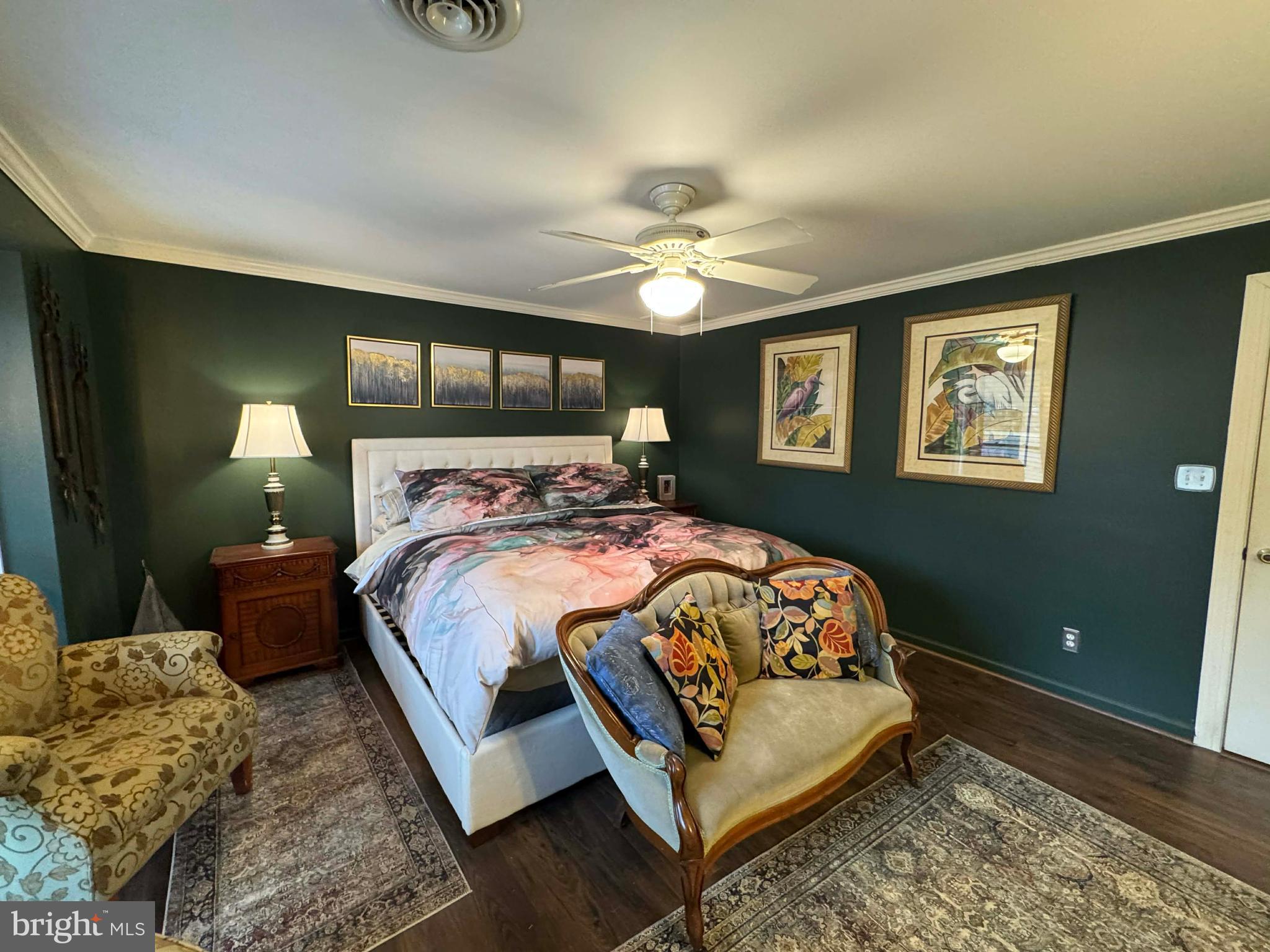 5000 Joshua Thomas Road Marion Station, MD 21838 - Photo 70 of 77 a bedroom with a bed and a chandelier